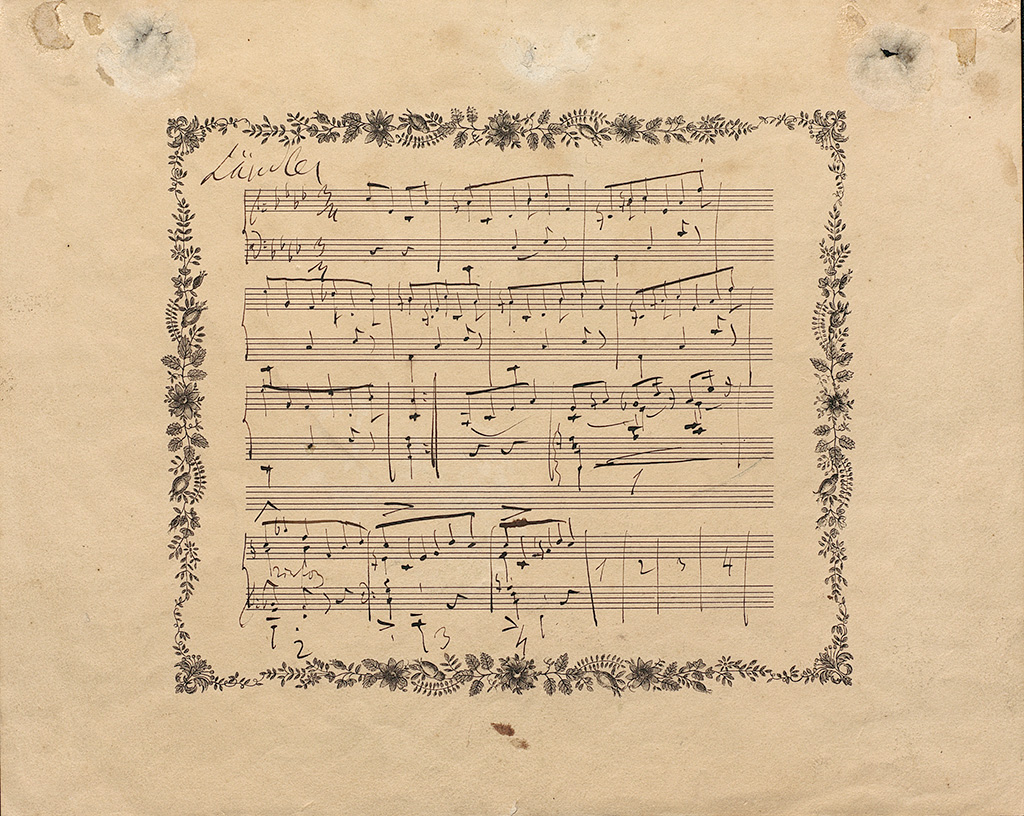Zu sehen ist eine eigenhändig niedergeschriebene Notenseite aus dem Ländler für Klavier von Franz Liszt, die der Komponist der Fürstin Amalie zu Fürstenberg am 25. November 1843 gewidmet hat.